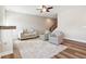 Living area featuring hardwood floors, seating area, and ceiling fan at 11436 Mossy Ct # 102, Fishers, IN 46037