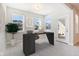 Bright home office featuring a modern desk, outdoor views, and ample natural light for productivity at 11436 Mossy Ct # 102, Fishers, IN 46037