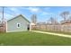 Well-maintained backyard with lush green grass and a fenced perimeter provides privacy and a safe space for outdoor enjoyment at 1224 Keystone Ave, Indianapolis, IN 46201