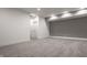 Spacious basement with neutral walls, recessed lights, and plush grey carpet at 1224 Keystone Ave, Indianapolis, IN 46201