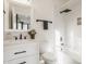 Bright bathroom featuring a shower-tub combo with a black rainfall shower head at 1224 Keystone Ave, Indianapolis, IN 46201