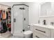 Bathroom with a glass shower, open closet storage and a modern vanity sink at 1224 Keystone Ave, Indianapolis, IN 46201