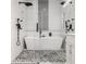 Modern bathroom featuring a large bathtub, pebble floors and dual shower heads at 1224 Keystone Ave, Indianapolis, IN 46201
