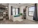 Bright bedroom with large windows, curtains, and a white bed frame with storage at 1224 Keystone Ave, Indianapolis, IN 46201