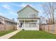 Charming two-story home with a inviting front porch and manicured front lawn at 1224 Keystone Ave, Indianapolis, IN 46201