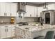 Kitchen with granite counters, stainless appliances, island and white cabinets at 1224 Keystone Ave, Indianapolis, IN 46201