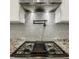 Range with stainless steel hood, pot filler and decorative backsplash at 1224 Keystone Ave, Indianapolis, IN 46201