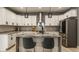 Gourmet kitchen featuring white cabinets, granite countertops, stainless steel appliances, and an island at 1224 Keystone Ave, Indianapolis, IN 46201