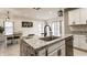 Kitchen island with granite counters, stainless steel dishwasher, and a stainless steel faucet at 1224 Keystone Ave, Indianapolis, IN 46201