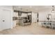Bright, open-concept kitchen with white cabinets, granite counters, and modern stainless appliances at 1224 Keystone Ave, Indianapolis, IN 46201