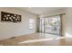Bright living room featuring hardwood floors and large glass doors to the outdoor patio at 1224 Keystone Ave, Indianapolis, IN 46201