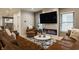 A comfortable living room with an open layout, a modern fireplace, and a plush leather sectional sofa at 1224 Keystone Ave, Indianapolis, IN 46201
