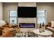 Comfortable living room featuring a modern fireplace and a large flat screen television at 1224 Keystone Ave, Indianapolis, IN 46201