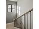 Staircase featuring modern railings and black metal spindles that let in great natural light at 1224 Keystone Ave, Indianapolis, IN 46201