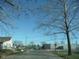 Residential street scene with houses and trees at 1300 W 13Th St, Muncie, IN 47302