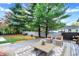 Relaxing backyard patio with an area rug, seating and a beautiful view of the yard at 233 W Westfield Blvd, Indianapolis, IN 46208