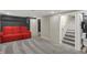 Finished basement with movie screen and stairs with half bath at 233 W Westfield Blvd, Indianapolis, IN 46208