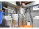 Basement mechanicals including water softener, water heater, and furnace are all in good working order at 233 W Westfield Blvd, Indianapolis, IN 46208
