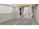 Finished basement area with neutral gray carpet, sliding glass doors, and access to a small closet space at 233 W Westfield Blvd, Indianapolis, IN 46208