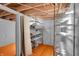 Unfinished basement area with metal shelving and storage space at 233 W Westfield Blvd, Indianapolis, IN 46208