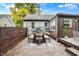 Outdoor deck with seating area and dining table provides an ideal space for entertaining at 233 W Westfield Blvd, Indianapolis, IN 46208