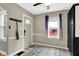 Welcoming entryway with a stylish rug and ample natural light, creating a warm and inviting atmosphere at 233 W Westfield Blvd, Indianapolis, IN 46208