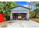 Garage interior with multiple vehicles and storage at 233 W Westfield Blvd, Indianapolis, IN 46208