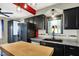 Inviting kitchen with black cabinetry, stainless appliances, and a bright window, perfect for everyday use at 233 W Westfield Blvd, Indianapolis, IN 46208