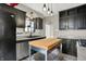 Bright kitchen with stainless steel appliances and plenty of counter space, ideal for home cooking and meal prep at 233 W Westfield Blvd, Indianapolis, IN 46208
