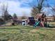 Backyard featuring playset, swing set, and chicken coop at 3163 S 25 E, Shelbyville, IN 46176