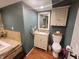 Basement bathroom with a vanity, toilet, and stone accent wall at 3163 S 25 E, Shelbyville, IN 46176