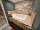 Relax in this spa-like bathroom, featuring a soaking tub and stone tile accents at 3163 S 25 E, Shelbyville, IN 46176