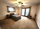 Bright bedroom with sliding doors leading to a deck at 3163 S 25 E, Shelbyville, IN 46176