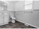 Clean bathroom with white vanity and dark flooring at 320 W 6Th St, Muncie, IN 47302