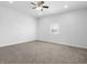 Spacious bedroom with ceiling fan and window at 320 W 6Th St, Muncie, IN 47302