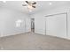 Large bedroom with ceiling fan and double door closet at 320 W 6Th St, Muncie, IN 47302