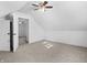 Bright bedroom featuring carpet, ceiling fan and access to other rooms at 320 W 6Th St, Muncie, IN 47302