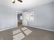 Light blue bedroom with ceiling fan and door to living area at 320 W 6Th St, Muncie, IN 47302