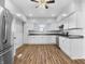 Modern kitchen with white cabinets and stainless steel appliances at 320 W 6Th St, Muncie, IN 47302