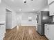 Updated kitchen featuring white cabinets and stainless steel fridge at 320 W 6Th St, Muncie, IN 47302