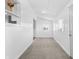 Spacious living room, featuring neutral carpeting and white walls at 320 W 6Th St, Muncie, IN 47302