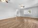 Spacious living room with hardwood floors and ceiling fans at 320 W 6Th St, Muncie, IN 47302