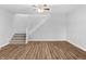 Gray carpeted stairs leading to upper level at 320 W 6Th St, Muncie, IN 47302