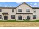 Rear exterior showcasing siding, glass doors, and grassy area at 4183 Douro Trl, Westfield, IN 46062