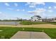 Beautiful new construction home with lake view and lush grassy area with blue skies at 4183 Douro Trl, Westfield, IN 46062