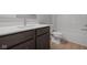 Bathroom featuring a sleek vanity and modern sink, alongside a toilet and shower at 4183 Douro Trl, Westfield, IN 46062