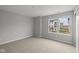 A cozy bedroom featuring neutral walls, carpet, a window, and closet at 4183 Douro Trl, Westfield, IN 46062