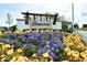 Bonterra community entrance with a white brick sign and colorful flowers at 4183 Douro Trl, Westfield, IN 46062