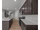 Spacious kitchen showcases quartz countertops, stainless steel appliances, and access to the home's upper floors at 4183 Douro Trl, Westfield, IN 46062