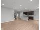 Open concept kitchen and living room area boasting stainless steel appliances and an island sink at 4183 Douro Trl, Westfield, IN 46062